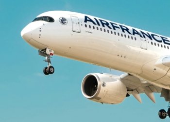 a large airfrance jet flying through a blue sky