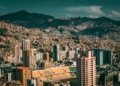 A stunning aerial view of La Paz, Bolivia with a backdrop of mountains and urban architecture.