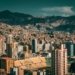 A stunning aerial view of La Paz, Bolivia with a backdrop of mountains and urban architecture.