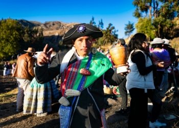 Colorful Andean festival in Caylloma, Peru showcasing traditional costumes and cultural heritage.