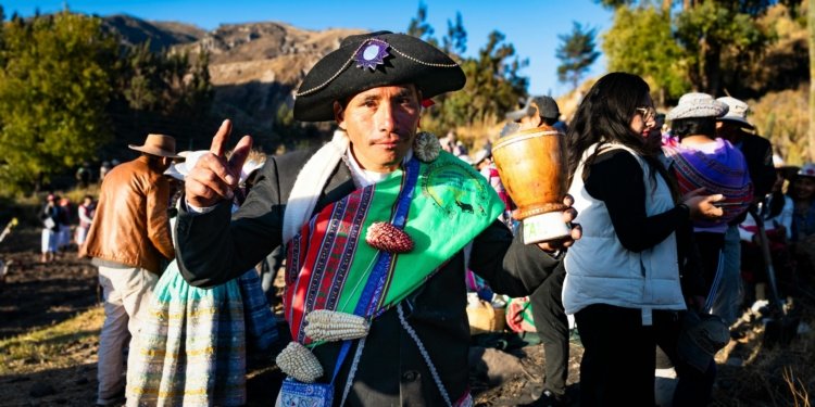 Colorful Andean festival in Caylloma, Peru showcasing traditional costumes and cultural heritage.