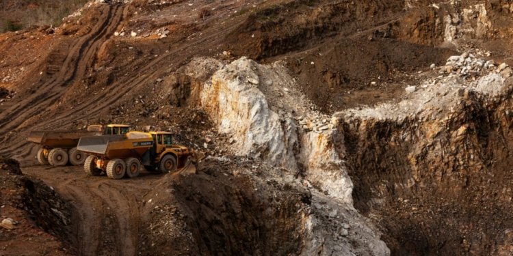 a large truck driving down a dirt road