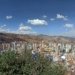 a view of a city with mountains in the background
