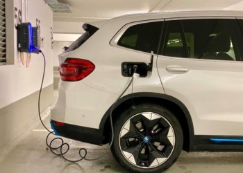 an electric car plugged in to a charging station
