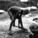 Black and white photo of children working under the rain in rural Bangladesh.