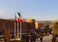 Karim Khan Citadel with Iranian flags in Shiraz, Iran at sunset.