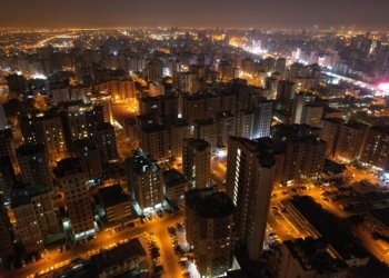 an aerial photography of city buildings at night