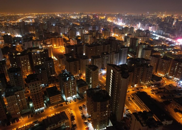 an aerial photography of city buildings at night