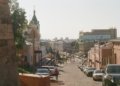 a street with cars parked on both sides of it