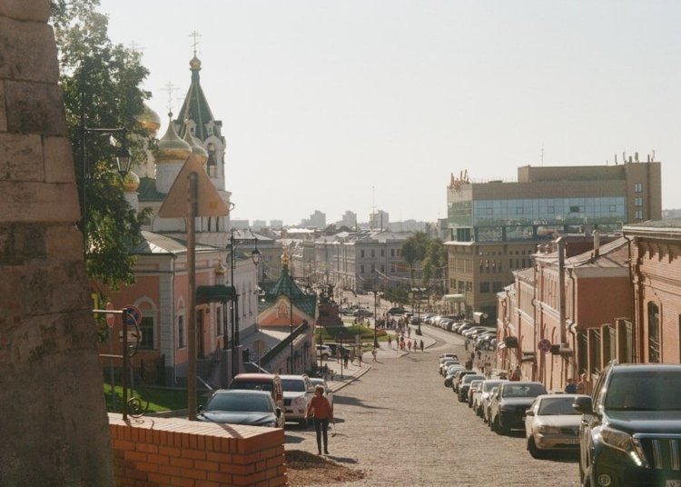 a street with cars parked on both sides of it
