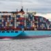 blue and red cargo ship on sea during daytime