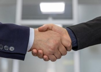 Close-up of a business handshake representing a successful partnership or agreement.