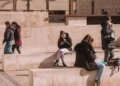 people sitting on walls