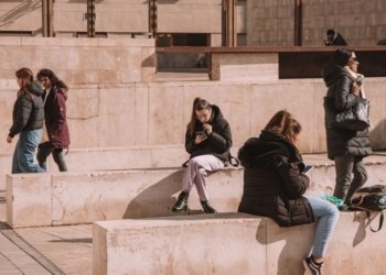 people sitting on walls