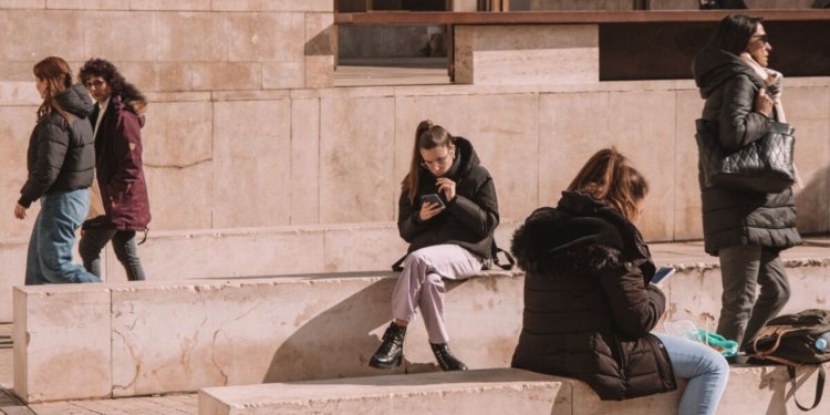 people sitting on walls