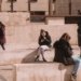 people sitting on walls