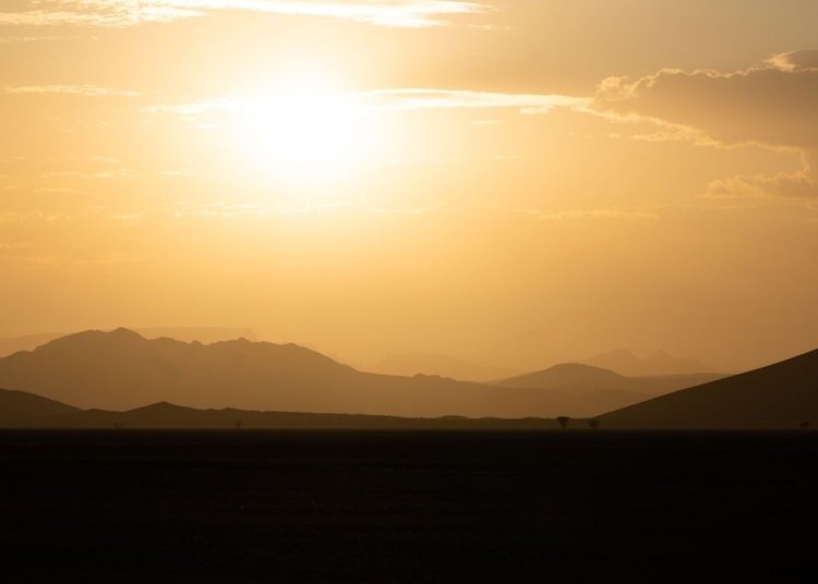 silhouette of mountains during sunset