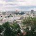 A scenic aerial view of Kyiv cityscape featuring a Ferris wheel and iconic landmarks.
