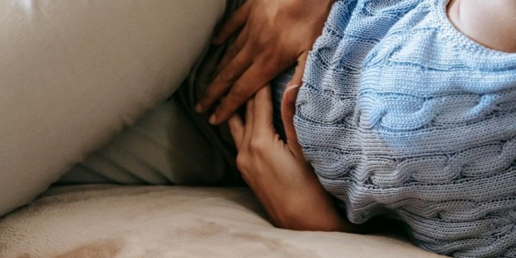 woman suffering from a stomach pain