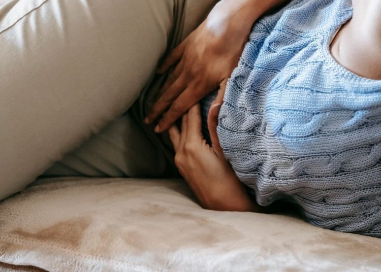 woman suffering from a stomach pain