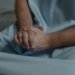 patient with his hands together