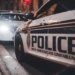 Close-up of Royal Newfoundland Constabulary police cars parked on a street at night.