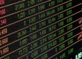 Detailed view of a stock market screen showing numbers and data, symbolizing financial trading.