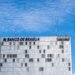 Front view of Banco de Brasília building with a clear blue sky and modern architecture.