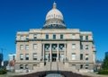 Front view of the historic Idaho State Capitol Building under blue skies in Boise.