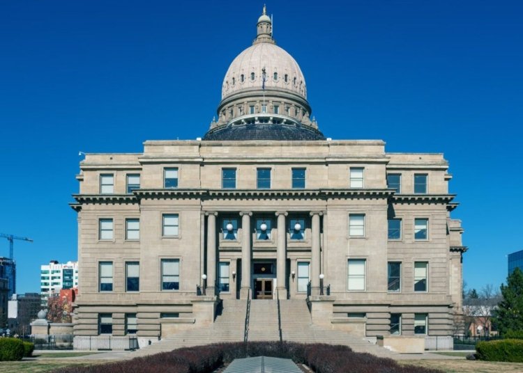 Front view of the historic Idaho State Capitol Building under blue skies in Boise.